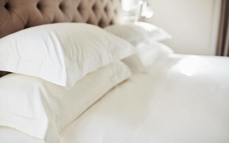 Large bed with white sheets