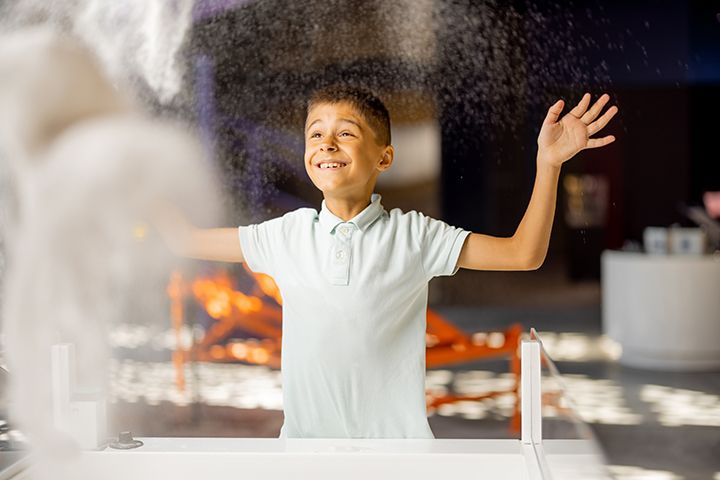 Young boy playing at a science center